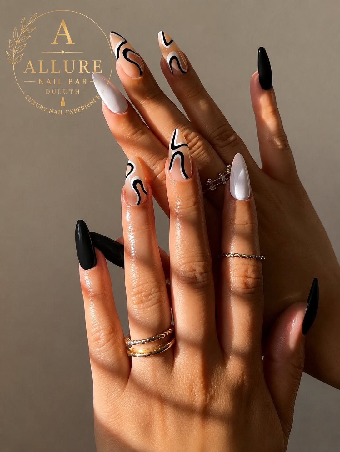 Nude nails with black and white abstract swirl nail art at Allure Nail Bar Duluth